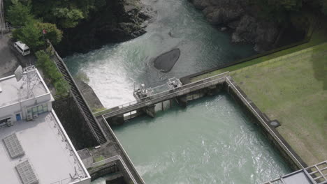 water flow control facility of ogouchi reservoir from observation deck in hara, okutama, japan