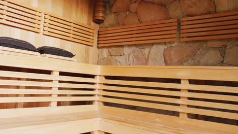 video of empty wood clad sauna room interior at holiday health spa resort