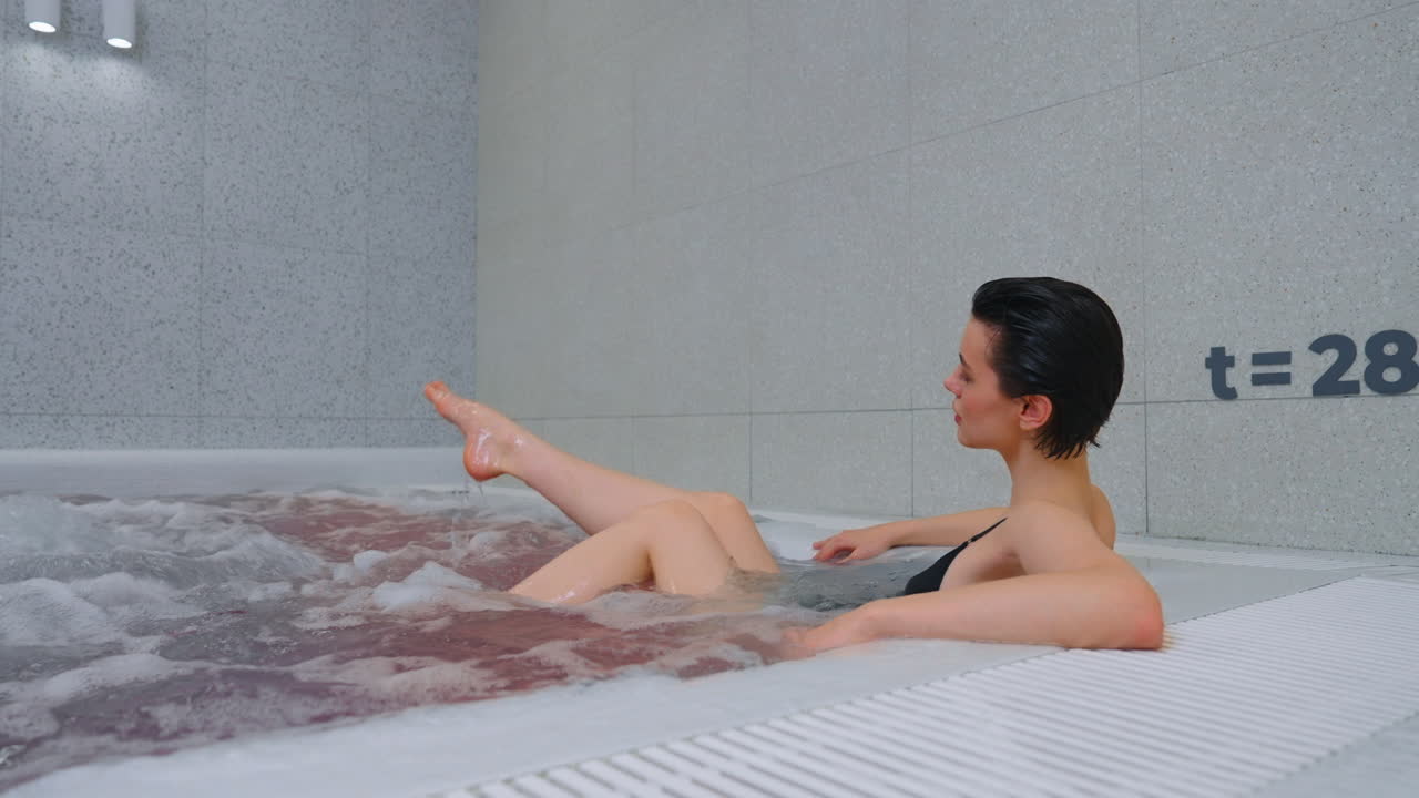 Woman Relaxing in a Modern Hot Tub