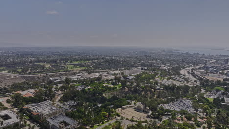 san diego california aerial v70 panoramic panning view flyover balboa park capturing multiple attractions and downtown cityscape with plane landing in the sky - shot with mavic 3 cine - september 2022