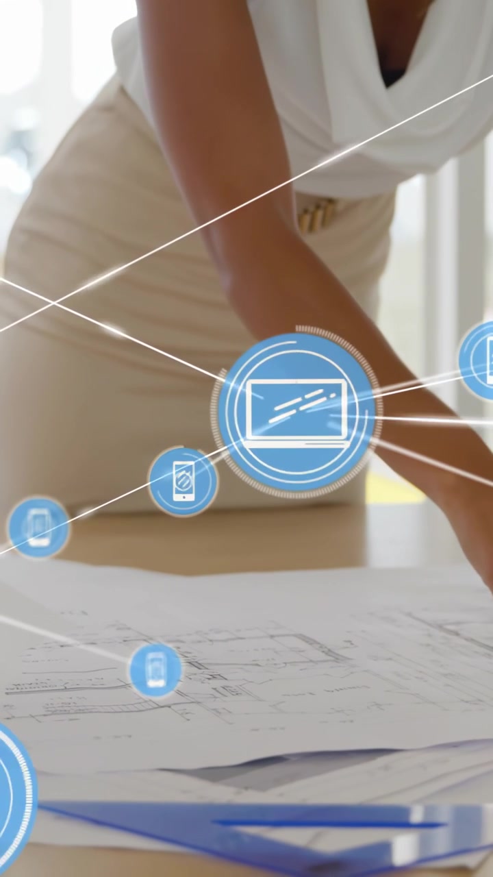 Video vertical: Mujer alisando planos y generando iconos azules de teléfono y laptop que se conectan en diseños.