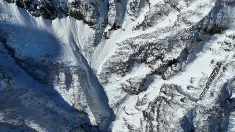 Top-down-establishing-shot-of-Japan's-mount-myōkō-and-valley,-shot-on-a-clear-winter-day,-a-volcanic-mountain-in-Myoko-Togakushi-Renzan-National-Park-region