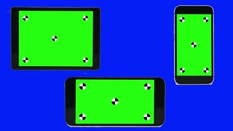 green screen technology concept. modern smart phone, tablet and computer mock up with green screen, alpha channel and tracking markers.