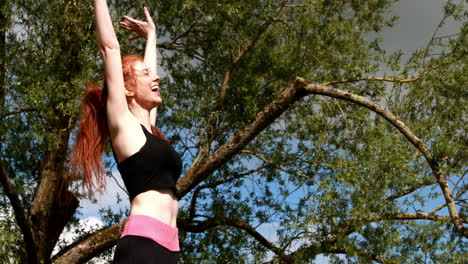 fit redhead jumping and cheering