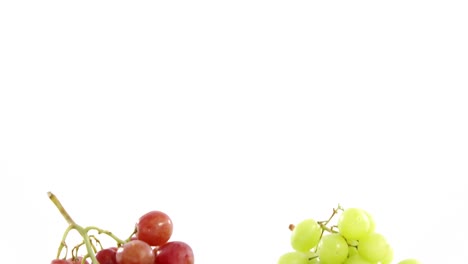 Close-up-of-green-and-red-bunches-of-grapes