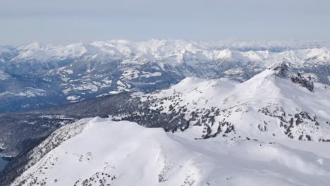 Beautiful-Winter-Snowy-Mountain-Range-Scene-AERIAL