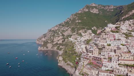 aerial drone shot flying near buildings in positano, italy