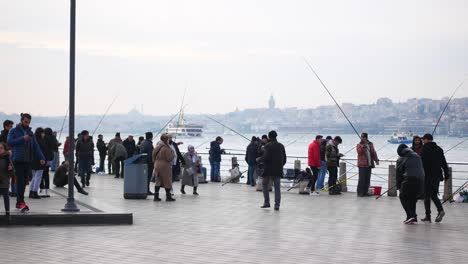 people fishing at istanbul waterfront in winter