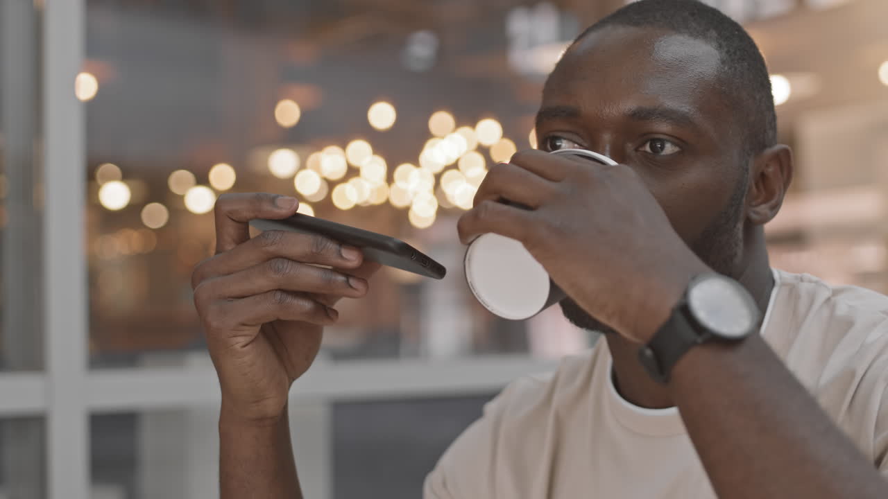 Close-Up of Afro-American Man Talking in Speakerphone