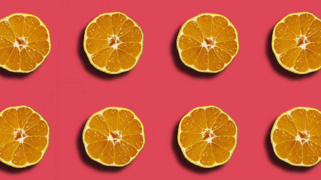 Coral background with mandarin pattern in geometric grid. Minimal motion graphics natural fruit looped animation