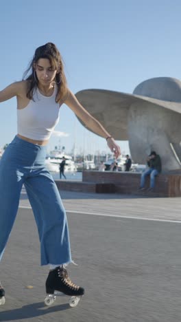 young woman roller skating in a sunny port