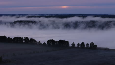 misty sunrise over a valley