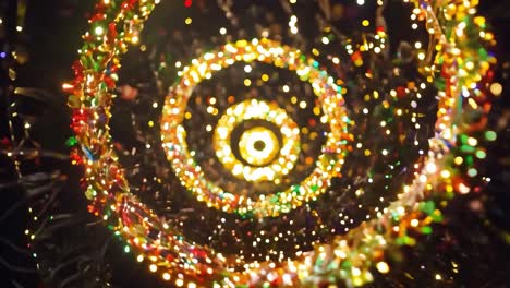 spiral tunnel of colorful christmas lights