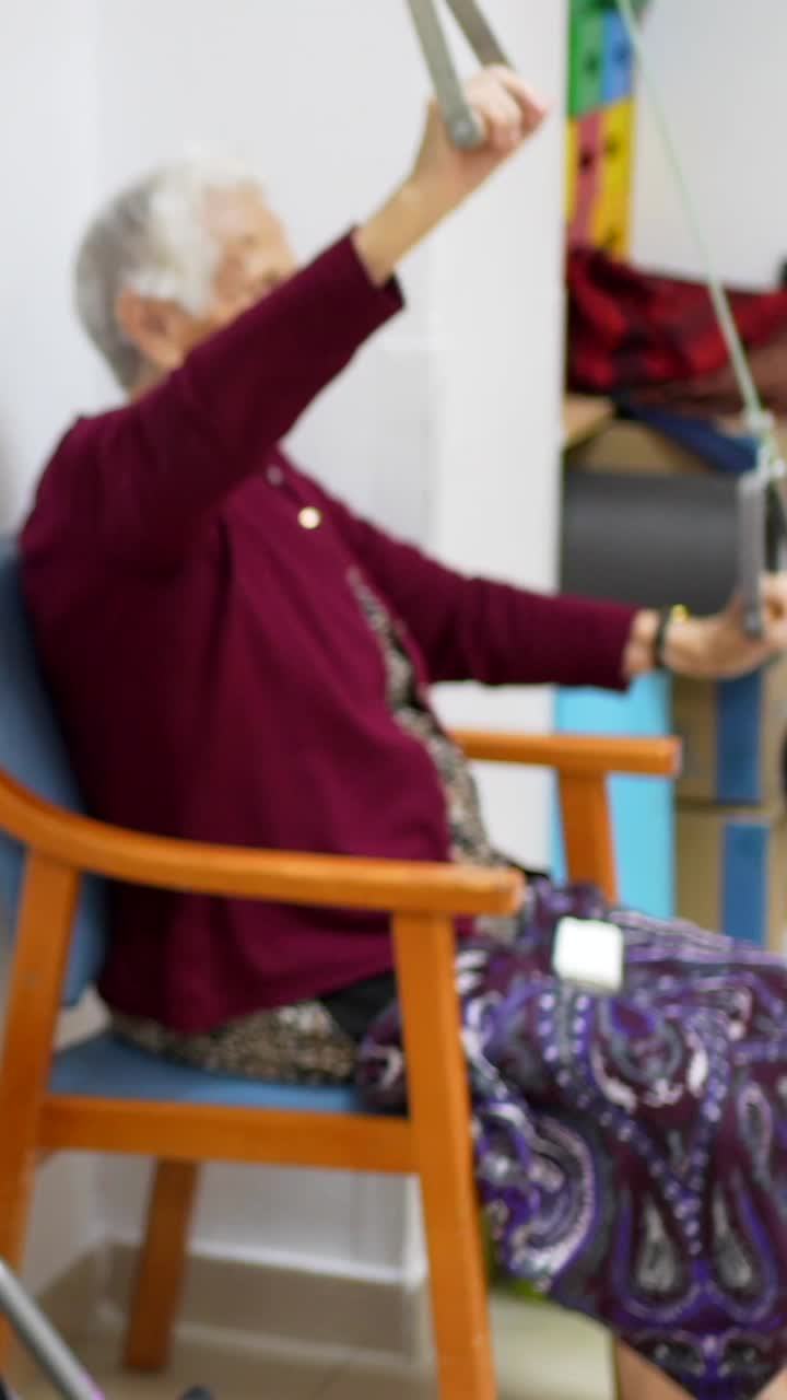 Senior Woman Exercising with Physical Therapy Equipment