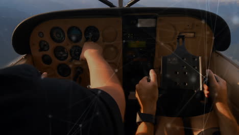 pilots operating aircraft controls with network connections animation over cockpit instruments