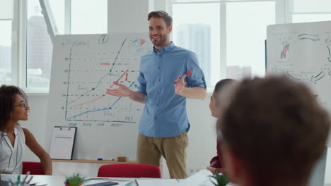 Business-coach-making-presentation-modern-office.-People-applauding-team-leader.