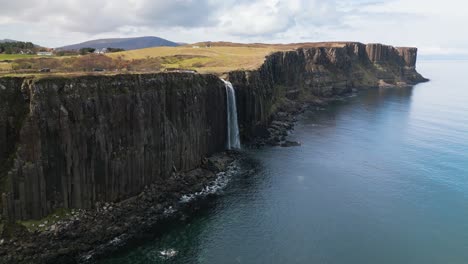 Drone-panning-shot-of-the-high-mealt-falls-in-Scotland-on-a-sunny-day