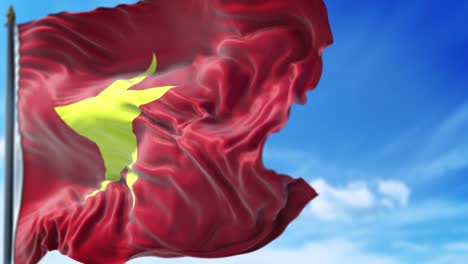 la bandera vietnamita está ondeando lentamente contra el cielo azul