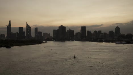 Saigon-River-day-to-night-time-lapse-with-Ho-Chi-Minh-City-Skyline-at-golden-hour