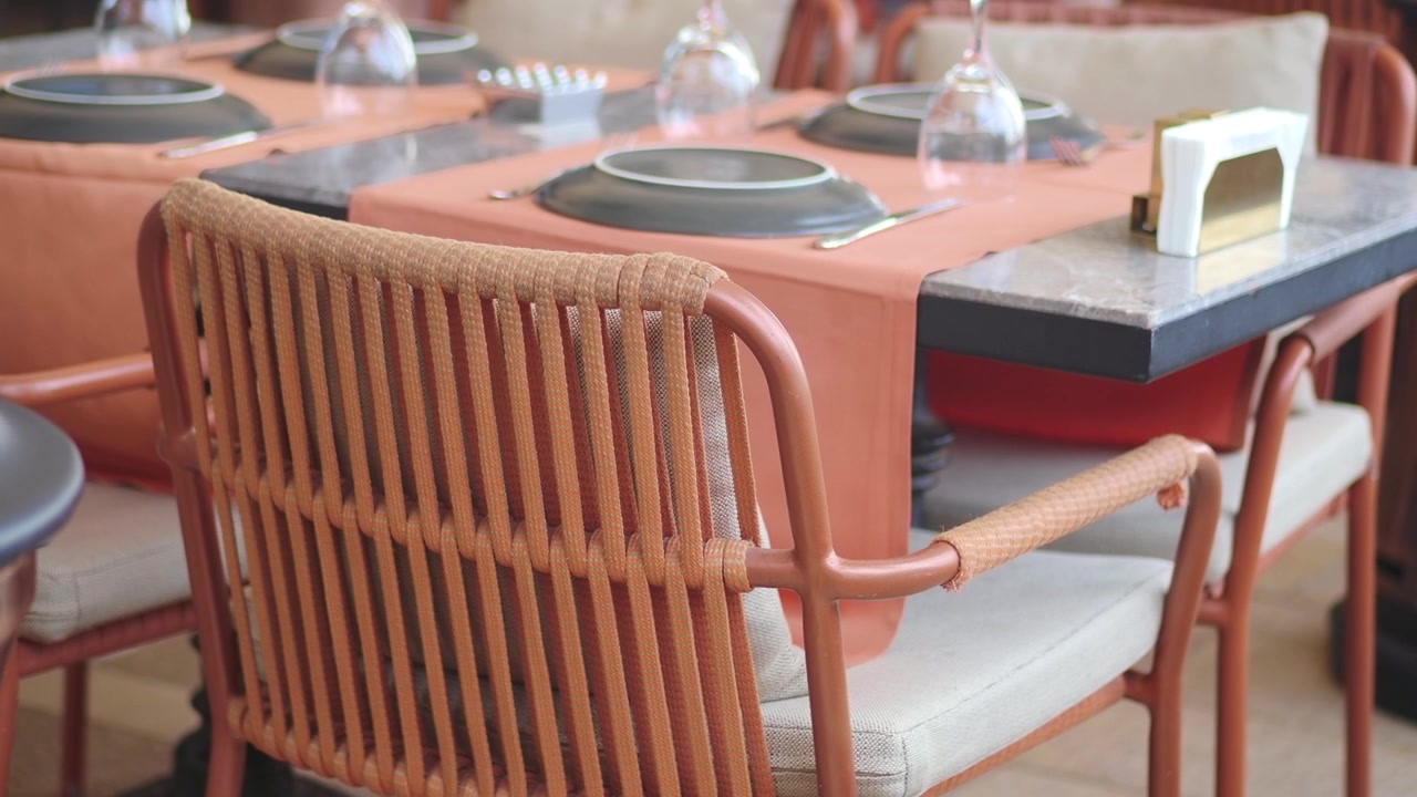 Modern Outdoor Restaurant Tables Set for Dining on a Patio