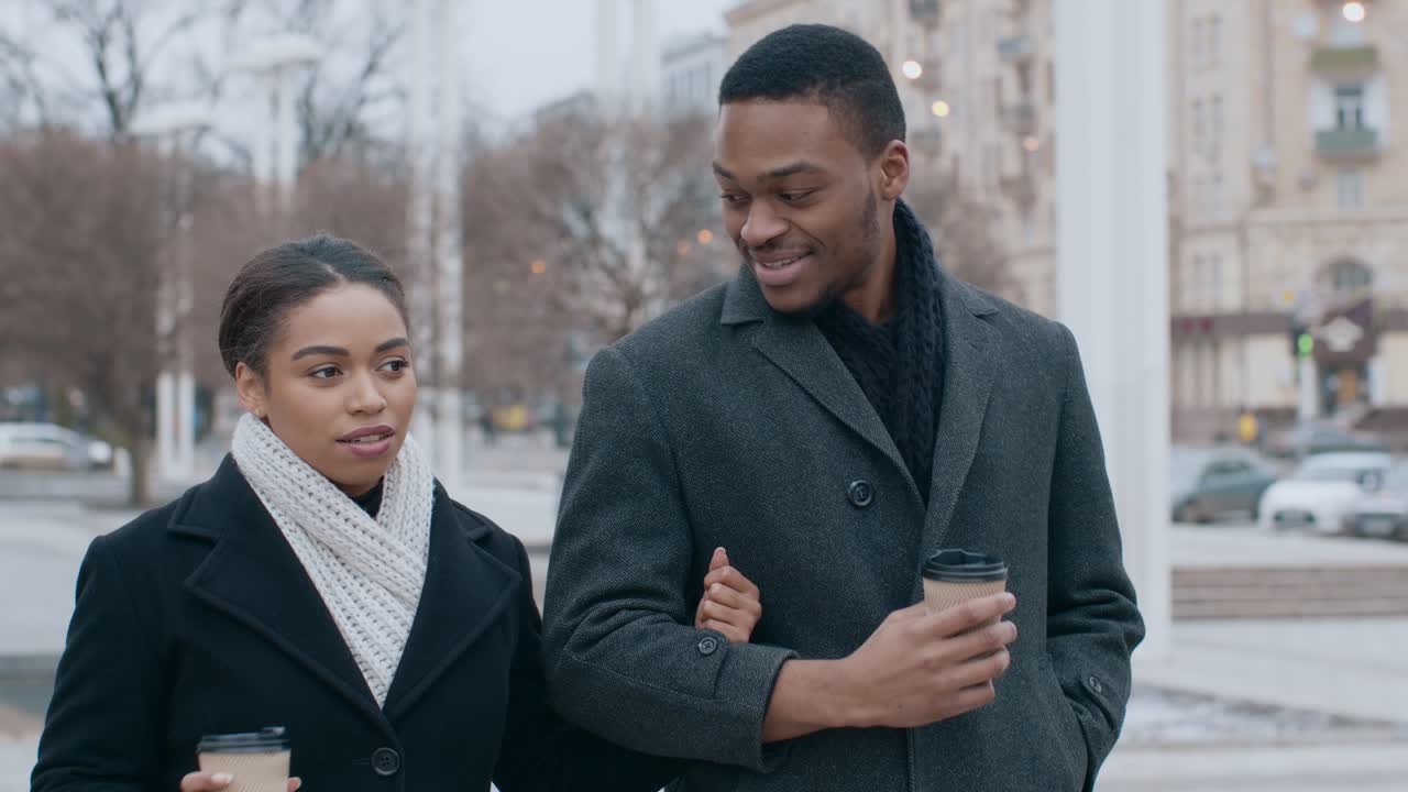 Couple Walking and Talking Outdoors
