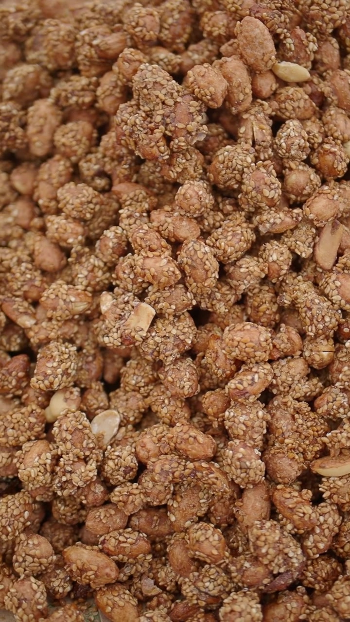 Close-up of Roasted Peanuts Coated with Sesame Seeds