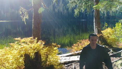 man and puppy hiking trail - pacific northwest forest lake