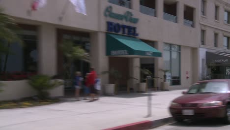 A-Car-Travels-Along-A-Street-In-Santa-Monica-California-As-Seen-Through-The-Rear-Window-At-An-Angle-6