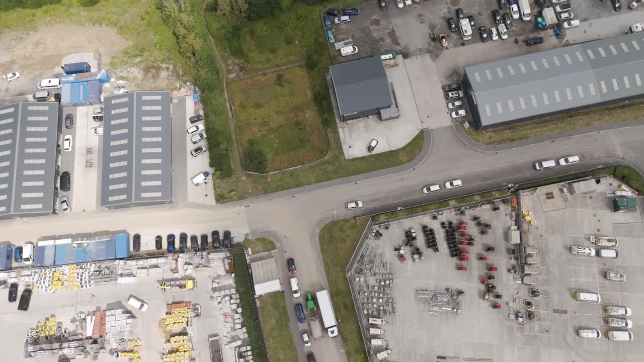 Aerial View of Industrial Area with Warehouses and Parking Lots