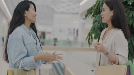 two women shopping in a mall
