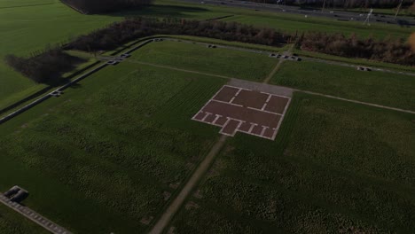 Aerial-focus-on-central-space-in-outlined-remains-of-roman-regiment-fortification-with-clear-blueprint-of-the-original-Waterlinie-defense-settlement