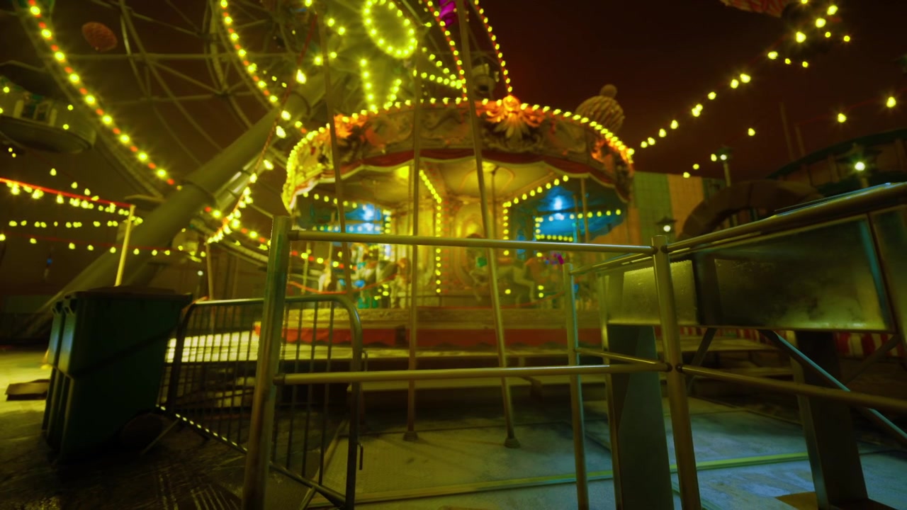 Frozen fairground scene with candlelit glow and metallic fences
