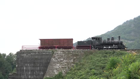 Train-in-bosnia-and-herzegovina-bosnian-train-cars-on-hill-stock-footage