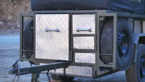 backside of a camper van with steel drawers to keep objects and devices