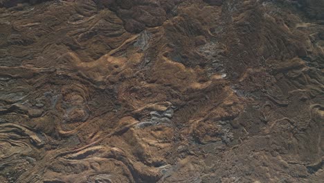 textured solid rock terrain formed after intense lava flow from volcanic eruption