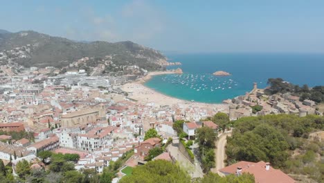 Beautiful-rocky-coast-with-beach-and-boats