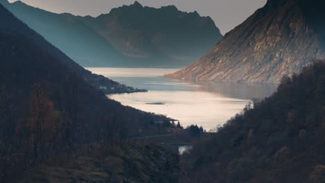 Mountains tower above the fjord on Senja Island