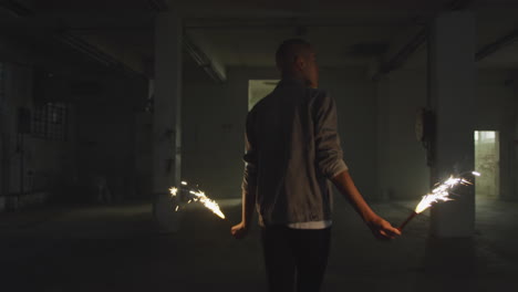 fashionable young man in an abandoned warehouse