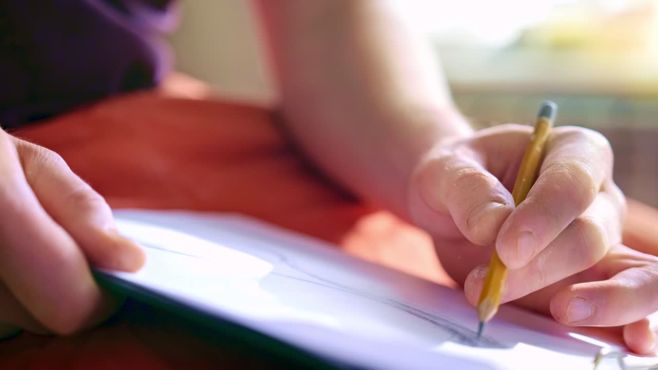 Focused Hand Drawing on Paper: A Close-up View of Artistic Creation Process Capturing Precision and Skill in Sketching with Pencil on Blank Document