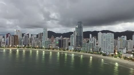 aerial view of sea side resort city balneario camboriu with mountain range in brazil