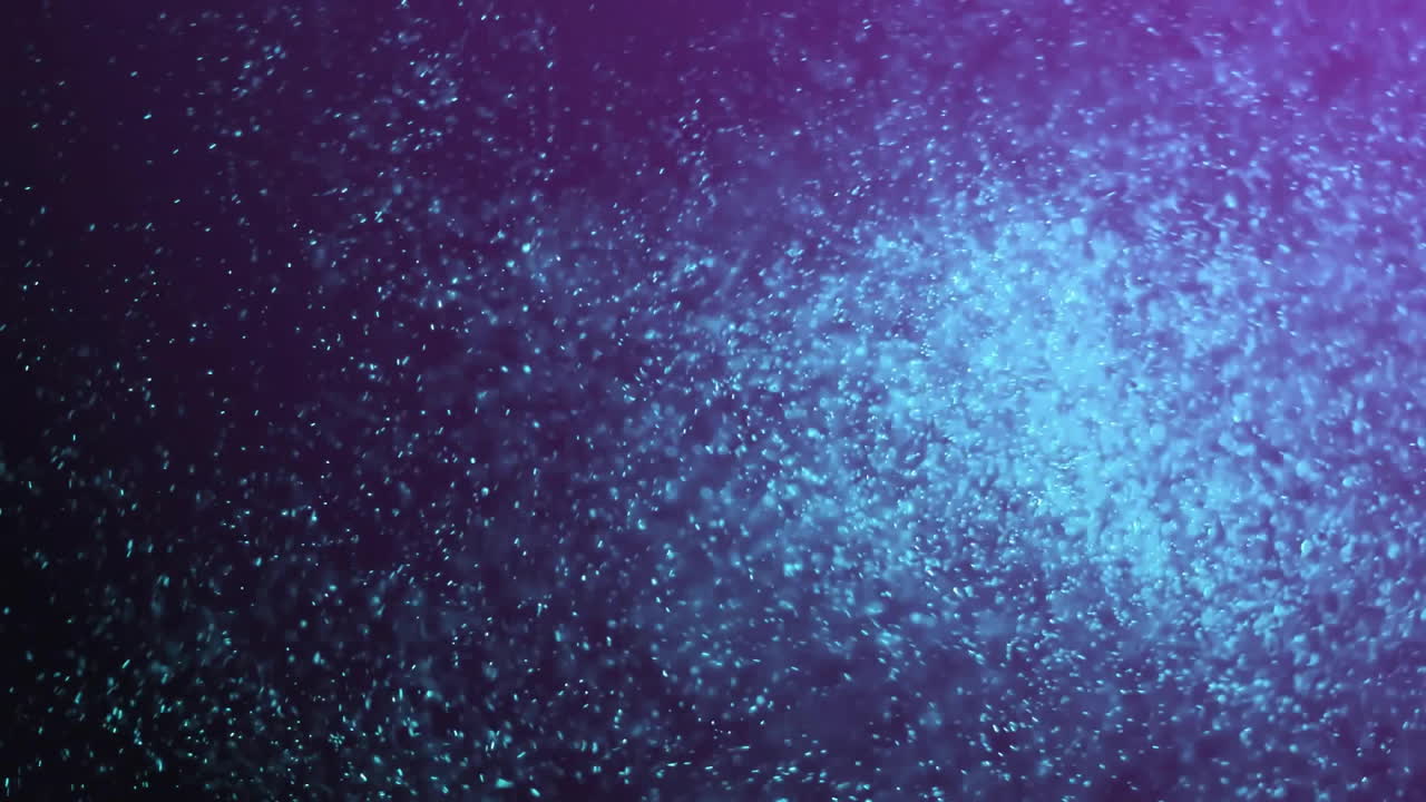 animación de manchas púrpuras que se mueven sobre un fondo negro