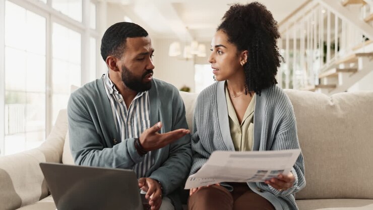 Couple discussing finances at home