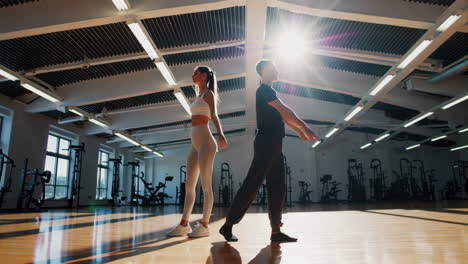 couple stretching in gym