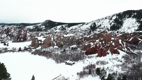 Roxborogh-State-Park-Golf-Course-aerial-drone-Colorado-Front-Range-after-winter-spring-deep-powder-fresh-snow-on-dramatic-sharp-red-rocks-mountain-landscape-Littleton-Denver-upward-motion