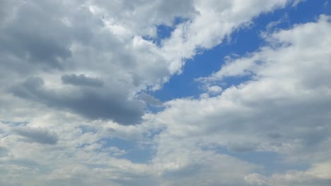 Cloudscape-time-lapse,-billowing-clouds-in-motion-on-a-summer-day-4k-video