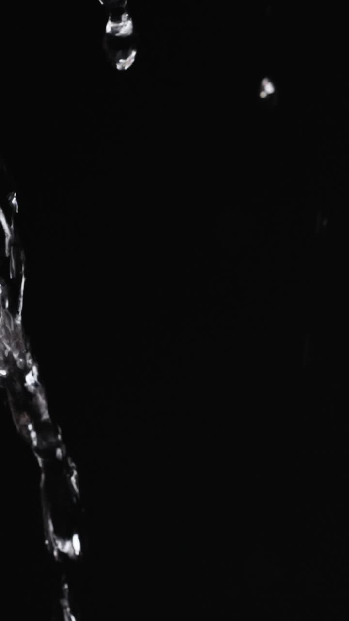 Water falling in the dark