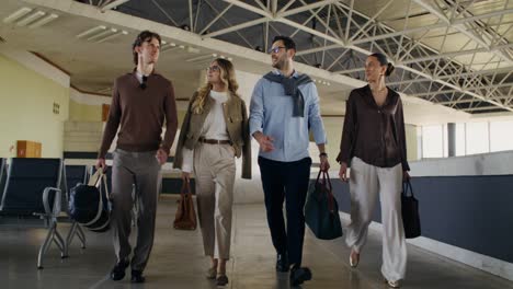 business professionals walking through airport