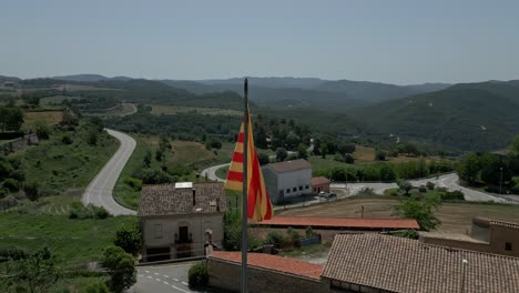 aerial rotational of the flag of catalonia flying gently in the breeze