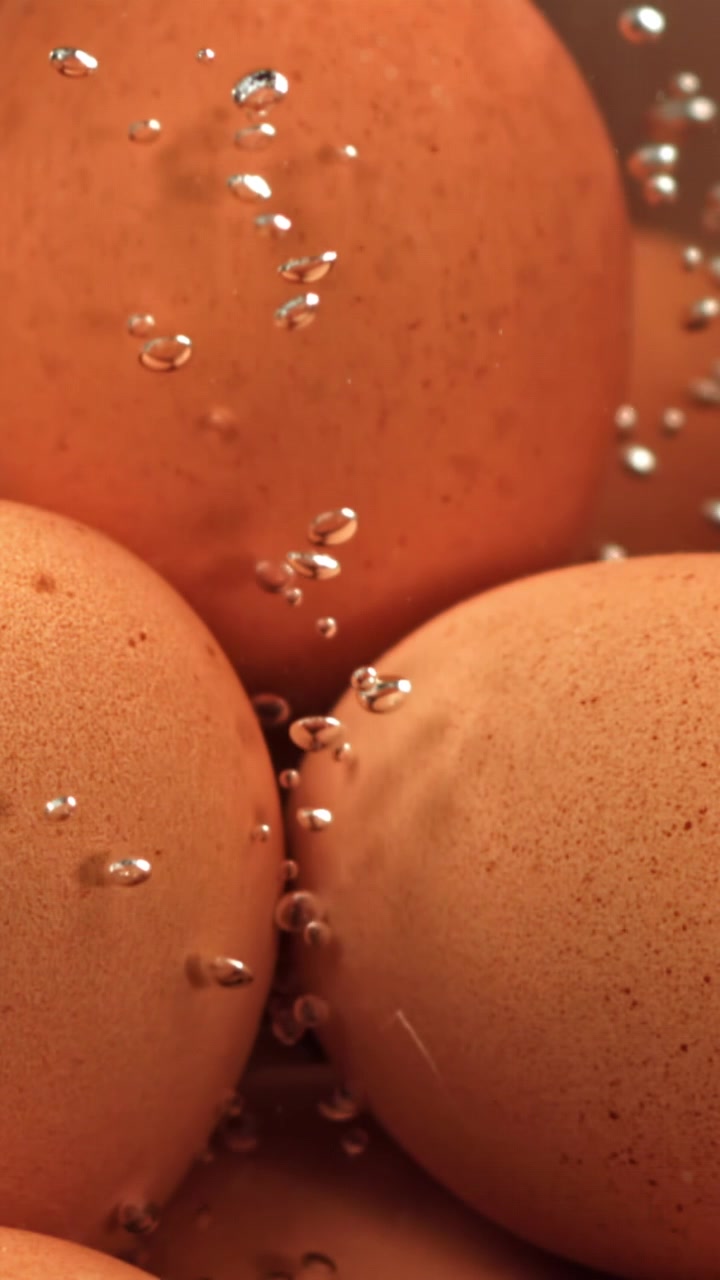 Close-up of Brown Eggs Boiling in Hot Water
