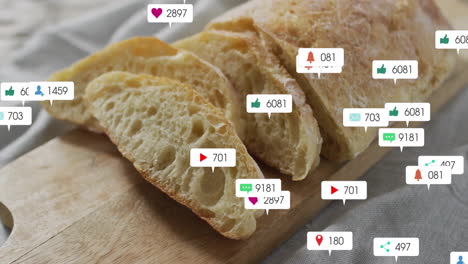 sliced bread on wooden board with animation of social media icons floating